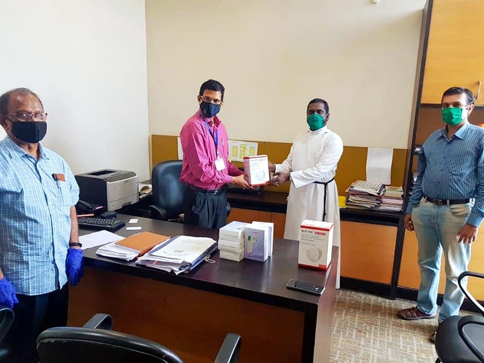 Seventh day handed over  the Sanitizer stands  and Sanitizing Solutions ,Thermal guns and masks for Covid Care Centre
